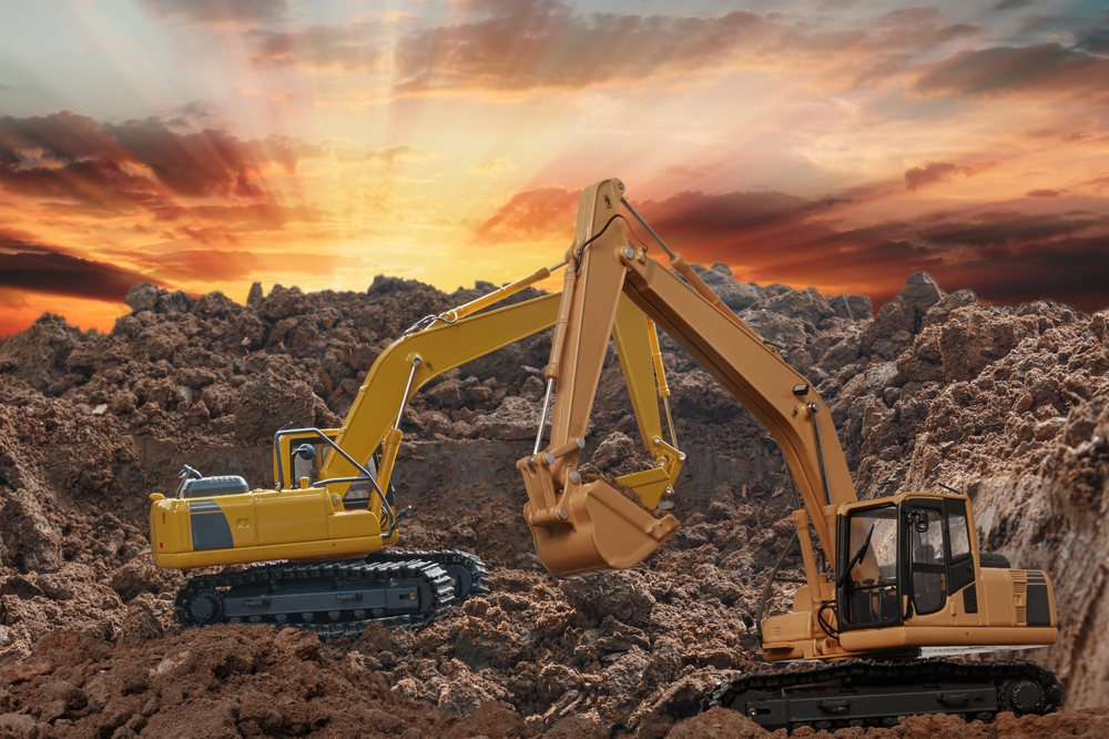 Two,Excavator,Digging,The,Soil,In,The,Construction,Site,On