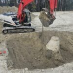 Whitehorse,,Yukon,,Canada,,June,29,,2025:,Excavator,Exposes,Precast,Sanitary