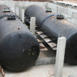 Four,Black,Large,Cylinder,Tanks,For,Underground,Gasoline,Storage,Installed